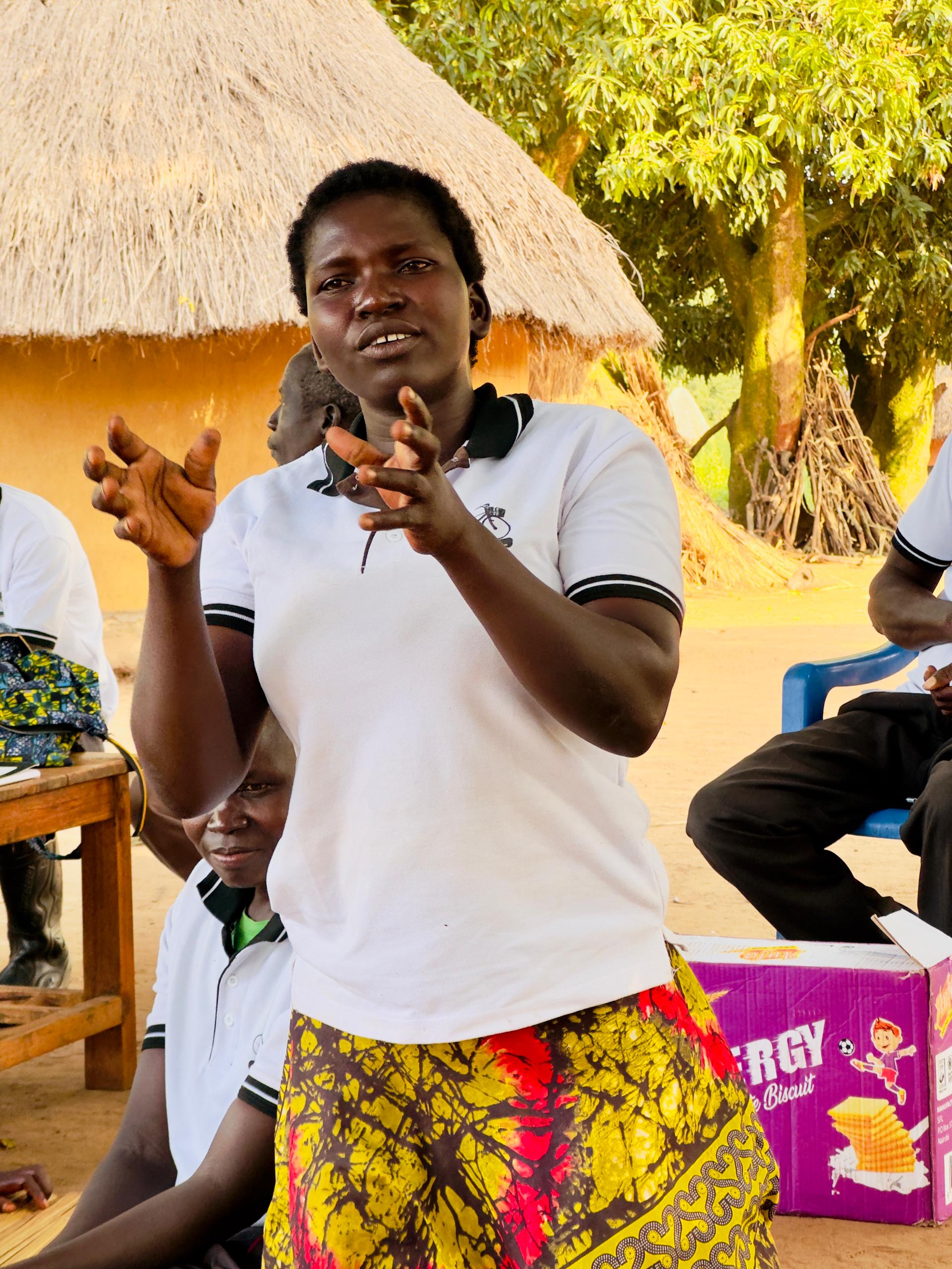 A woman speaks up during a Peace Project community dialogue in Atiak
